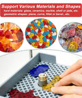 Person using cordless rechargeable stained glass grinder for art projects with five-eighth inch diamond bit on various materials.