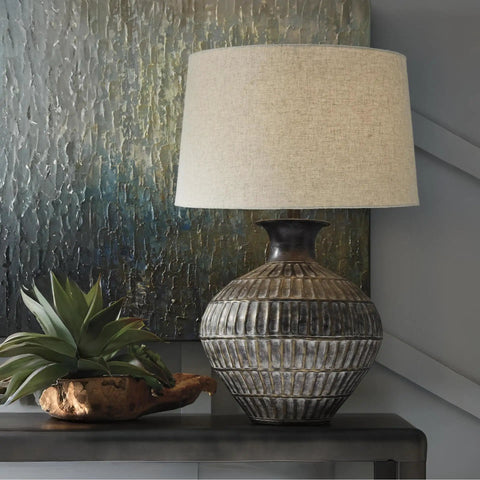 Magan 285 Textured Bronze Metal Table Lamp With Antique Brown Finish, Fabric Drum Shade on desk with plant