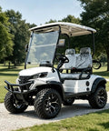 Top Shelf Two Seater Electric Golf Cart With 5kW Motor And 60V Battery Serving 20 Mph Cruising Speed Over 44 Mile Range in white on a path.