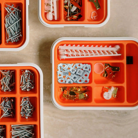 Forty Pack Carbon Steel T Slot Nuts Providing A Slick Sliding Fit And No Sweat Quick Install For Aluminum Extrusion Rails And Rock Solid Workshop Projects in orange storage boxes.