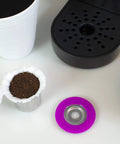 Stainless Steel Reusable K Cup For Keurig 1 Stream Coffee Pod With 25 Paper Filters, capsule lid, and coffee machine next to strawberries