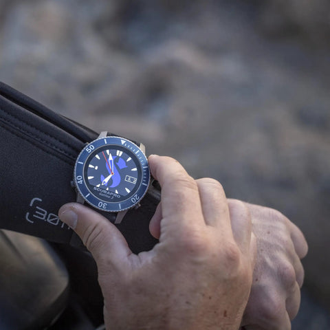 Close-up of a hand adjusting Dope Titanium Dive Wrist Computer With Wireless Transmitter, Gauge Mode And Full Color Display