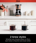Programmable XL 14 Cup Barista Grade Coffee Maker Pro With Permanent Filter Classic Or Rich Brew Delay Brew Freshness Timer Keep Warm Dishwasher Safe Copper Finish on kitchen counter with two cups of brewed coffee