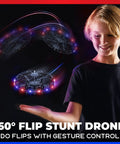 Child playing with Hand Operated LED Scoot Drone With Motion Sensor For Kids And Adults Indoor Flying UFO Toy showing lights and motion.