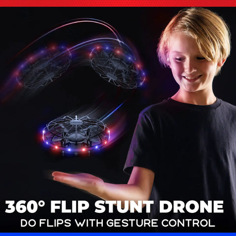 Child playing with Hand Operated LED Scoot Drone With Motion Sensor For Kids And Adults Indoor Flying UFO Toy showing lights and motion.