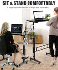 Two women using Rollin Standing Desk With Adjustable Height On Wheels For Treadmill Sessions Portable Sit Or Stand Computer Table, one sitting and one standing