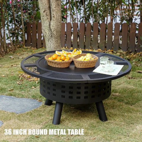 36 Inch Outdoor Fire Pit With Grill And Lid Wood Burning Fire Pit Table 3 In 1 Metal Fire Pit in grassy yard with snacks.