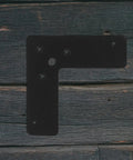 Tough As Nails 4 Piece Black L Shaped Stainless Steel Corner Brackets 2mm Thick Flat Angle Braces on wood background
