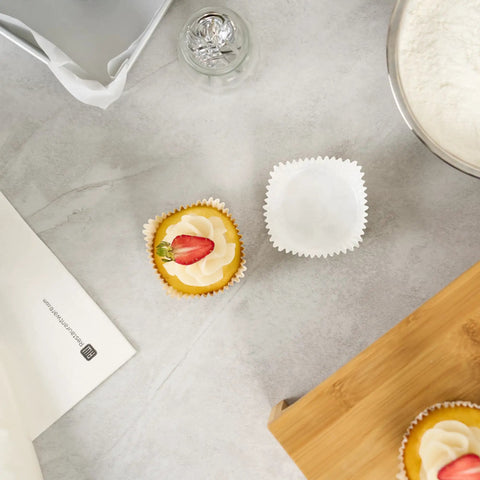 Greaseproof Cupcake Liners 4000 Pack, 4 Oz Disposable Muffin Cups for Oven or Freezer on kitchen counter with cupcake