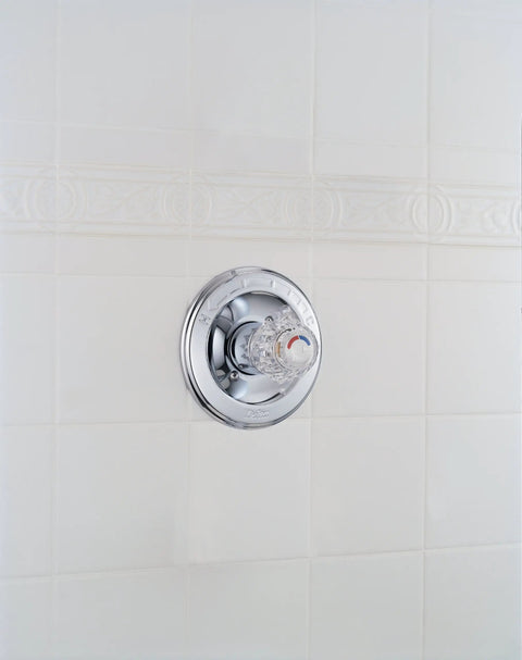 Chrome Shower Valve Trim Kit With Pressure Balance And Temperature Control Requires MultiChoice Universal Rough In R10000 UNBX Sold Separately Single Function on tiled wall.