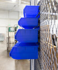 Side view of heavy duty storage bin wall panel system with 15 bins, bench mountable steel panels in a garage setting