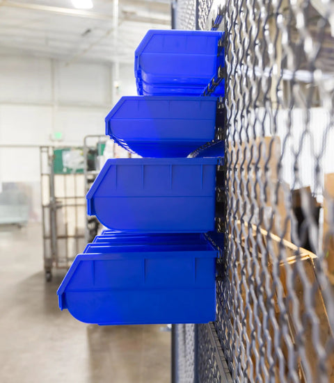 Side view of heavy duty storage bin wall panel system with 15 bins, bench mountable steel panels in a garage setting