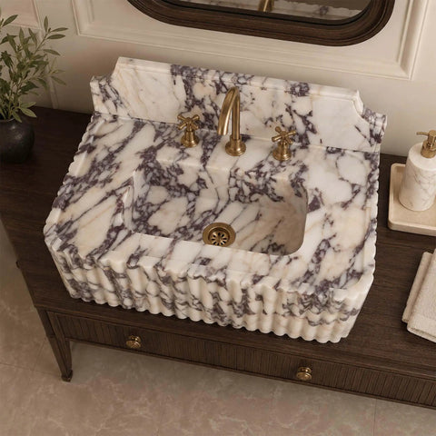 Calacatta Viola Marble Sink with Sculpted Backsplash, Fluted Vanity Washbasin, Hand-Carved Natural Stone Bathroom Basin, Custom Luxury Powder Room Sink, top view with gold faucet.