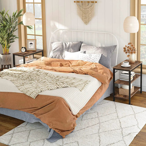 Rustic Brown And Black 3 Tier End Table With Open Storage Shelves Sleek Industrial Side Stand Fits Snugly In Tiny Spaces next to a bed.