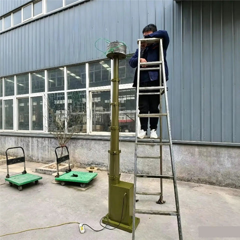 Rugged Aluminum Electric Telescopic Camera Mast With Solid Brake Gear And Smooth Push Button Lift Up To Five Meters being set up on a ladder.