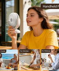 Person using Compact Desk Fan On The Go Quiet Rechargeable Mini Fan With 4 Speeds LED Display And LED Light for versatile use