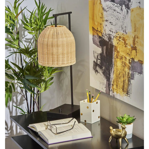 Bahama Table Lamp With Dark Bronze Finish For Warm Coastal Modern Vibes, 24.5in tall, rattan shade, on a desk.