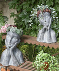 Gray concrete finish face head planter pot for succulents and small plants with drainage hole, artistic farmhouse decor on shelf.