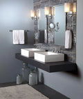 Chrome 5.94 Inch Dual Sided Extendable Wall Mount Mirror With 5X Magnification in modern bathroom setting above two sinks.