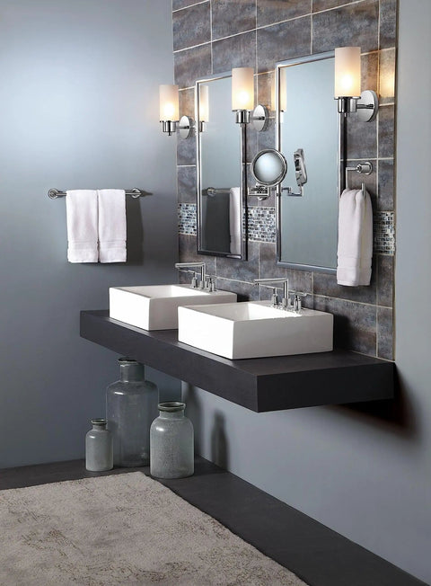 Chrome 5.94 Inch Dual Sided Extendable Wall Mount Mirror With 5X Magnification in modern bathroom setting above two sinks.
