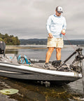 Man using G Force Heavy Duty Trolling Motor Replacement Handle With Cushioned Grip And Release Cord on bass boat in lake