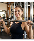 Woman using gym equipment with heavy duty carabiner clip with spring snap wire gate attached to bar