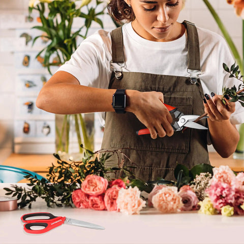 Woman using Beastly Heavy Duty Multipurpose Shop Scissors With Drop Forged Blades And Serrated Edge to trim flowers
