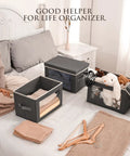 Dark Grey 3 Pack Fabric Storage Bins With Lid And Peek Window Collapsible Closet Organizers Tough Handle Crates on bed with folded clothes and toys.