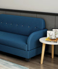 Blue sofa with round protective feet visible, showcasing Four Pack Plastic And Zinc Alloy Furniture Legs For Chairs And Cabinets.