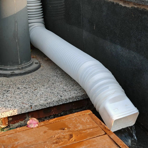 Two Pack Flexible Rain Gutter Downspout Extensions Extendable From 21 To 60 Inches With Split Design Drain Diverter in use