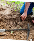 Gardener using Two Pack Steel Hand Hoe Set For Weeding And Gardening in soil, highlighting manual tool's effectiveness for backyard projects.