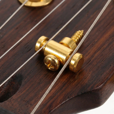Close-up of Premium Brass Electric Guitar String Trees Retainers on wooden headstock for secure tuning and intonation.