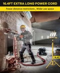 Heavy Duty Led Work Light With Beefy Telescoping Tripod, 30000 Lumens, Three Pivotable Heads, Waterproof Housing, And Badass 16 Ft Power Cable For Projects in use on construction site