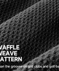 Close-up of black microfiber waffle weave pattern from Two Black Microfiber Waffle Golf Towels With Retractable Club Brush Pro Grade Clean Up