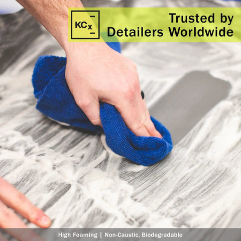 Person cleaning surface with cloth and Heavy Duty All Purpose Cleaner For Cars And More, Ultra Concentrated Multisurface Cleaner