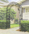 Sturdy Rust-Resistant Metal Garden Arch With Trellis For Climbing Plants 88 Inches High By 51 Inches Wide in a garden setting.