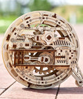 Mechanical Wooden 3D Puzzle Model Monowheel Construction Set For Gearhead Builders With A Steampunk Skeleton Showcasing Moving Dope Gears Durable Outdoor Ready So You Can Roll It On The Street Or Desk A Fun STEM Toy, laser-cut wood monowheel outdoors