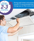 Man installing 14x25x1 Air Filter MERV 11 6-Pack For AC And Furnace, Electrostatic Pleated Design, easy replacement