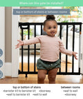 Deluxe Stair Gate For Pets And Kids, Super Easy Install No Fuss Secure Build, 32 Inches Tall, Black Wood in doorway with child