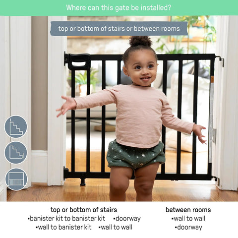 Deluxe Stair Gate For Pets And Kids, Super Easy Install No Fuss Secure Build, 32 Inches Tall, Black Wood in doorway with child