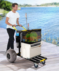 Foldable 2 In 1 Beach Wagon Cart with 12 Inch Balloon Wheels for sand, loaded with gear on a wooden walkway by water.