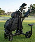 Badass Electric Golf Cart With Smart Follow Tech And Bluetooth Remote Control For Easy Fairway Gliding Compact Foldable Frame on golf course.