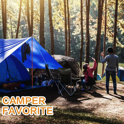 Heavy Duty Twenty By Thirty Foot Waterproof Tarp Thats Super Thick At Sixteen Mil And Tough As Nails For All Your Outdoor Needs Like Camping Tent Roof Boat Car Pool And Ground Cover In Blue used as a tent cover in a forest campsite.