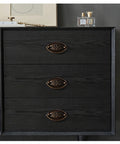 Dresser with Vintage Oval Drop Swing Drawer Pulls in Antique Brass, Zinc Alloy Hardware, installed on black wood surface, 3 drawers visible.