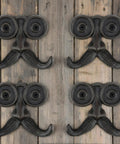 Heckin Durable Four Piece Cast Iron Beard Wall Hooks For Old School Farmhouse Charm And Dang Tough Rustic Decor Hanging Rack For Coats Scarves Towels Keys With Mounting Hardware Included, matte black hooks on wooden background.