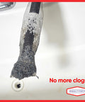 Washing machine lint trap in black mesh attached to hose, clogged with lint
