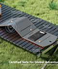 Go-To 10000mAh Solar Charger With 30W Foldable Panels on outdoor table, showing features like waterproof and built-in flashlight.