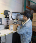 Person using Rock Solid Universal Printer Pole Mount With Full Motion Articulating Arm Adjustable Swivel Roll Play Tray for shipping.