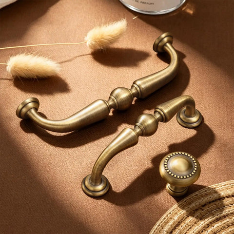 5.04 Inch Bronze Brass Cabinet Pulls Set Of 10 Vintage Style Handles on fabric surface, warm texture, easy grip