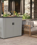 130 Gallon Outdoor Storage Cabinet With Lockable Door Backyard Oasis Basic Unit Peppercorn Finish on a patio with plants and sofa.